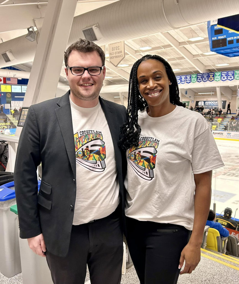 Tali Campbell and a Community Member in Coquitlam Express community t-shirts at the rink.
